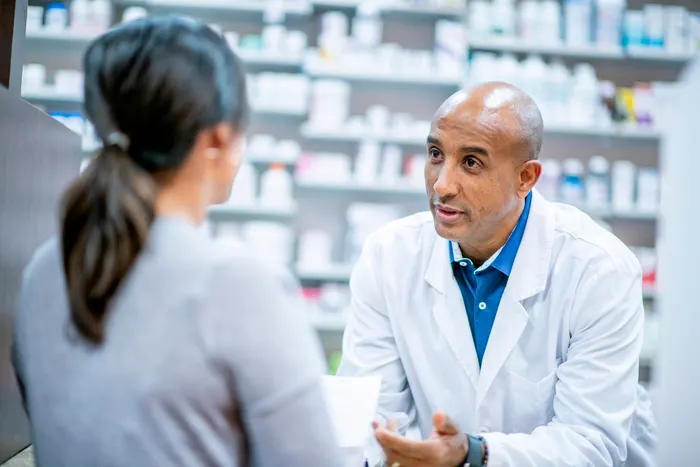 pharmacist talking to patient