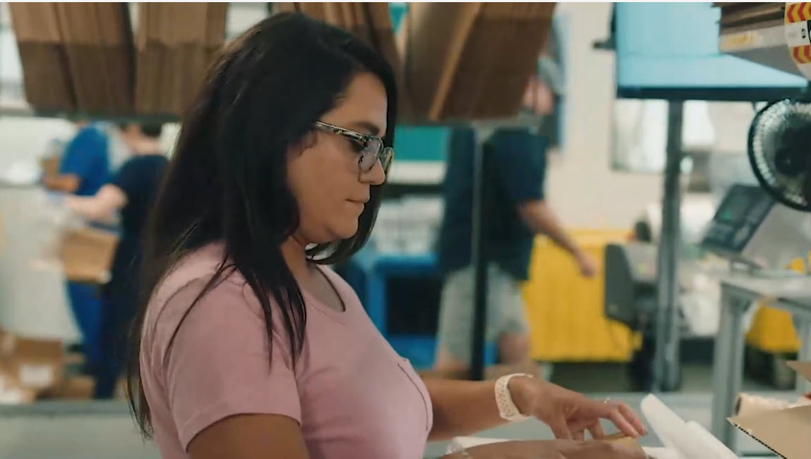 woman standing at work station