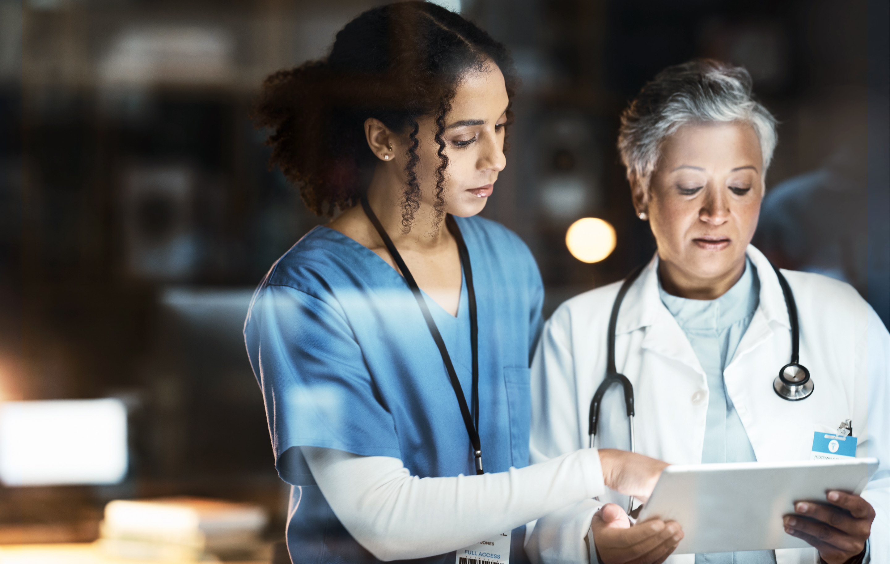 doctor and nurse looking at document