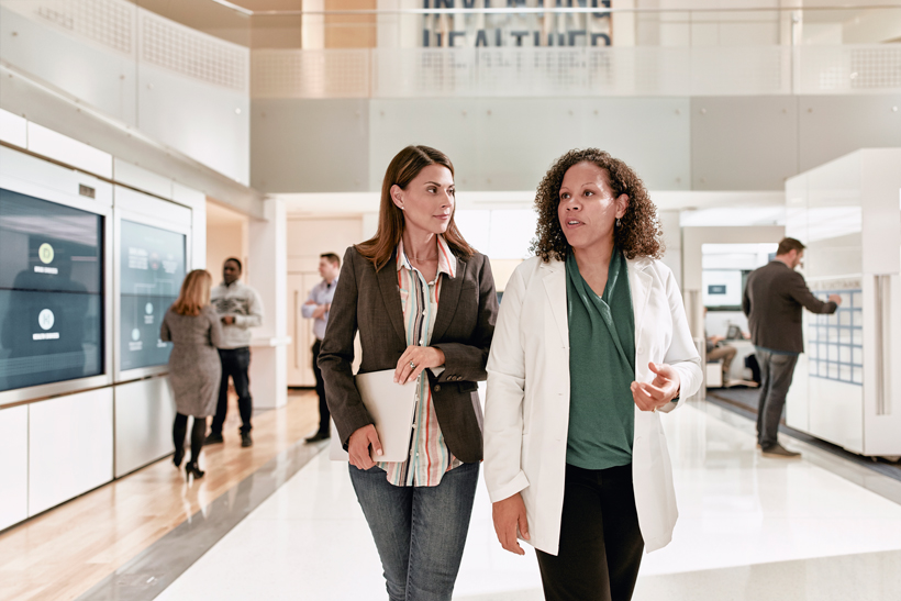 doctors walking and talking in hallway