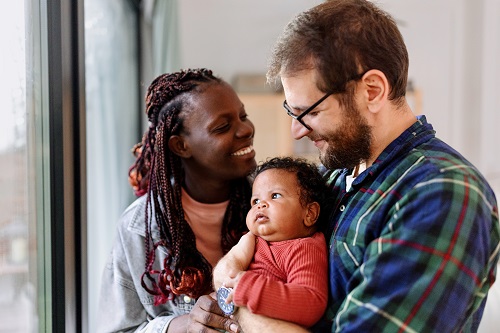 couple holding baby