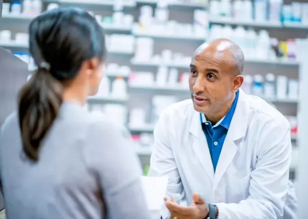 pharmacist talking to patient